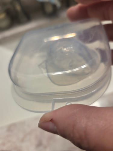 Customer photo of the SnoreGrip Pro device in its clear storage case
